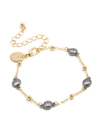 Showcasing a mixed metal and ball chain bracelet, with gold plated finish, cubic zirconia stones, and grey accents front view - link has visual effect only