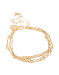 Beautifully crafted gold plated cubic zirconia bezel stone bracelets in a 3-pack front view - link has visual effect only