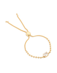 Elegant gold ball and cubic zirconia oval toggle chain bracelet featuring gold plated metal with clear accents front view - link has visual effect only