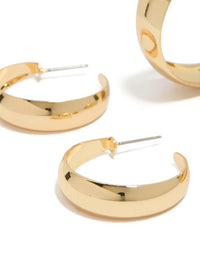 Detailed view of gold plated medium hoop earrings in a 2-pack close up view - link has visual effect only