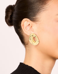 Featuring open organic circle stud earrings in gold plated material on ear view - link has visual effect only