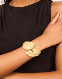 Featuring gold plated thick curved statement bangle on wrist view - link has visual effect only