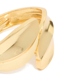 Crafted with gold plated metal thick curved statement bangle close up view - link has visual effect only
