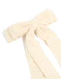 Crafted from textured lace, this ivory bow clip side view - link has visual effect only