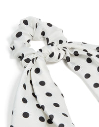 Featuring polyester with polka dot print in white and black scarf scrunchie side view - link has visual effect only