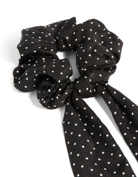 Featuring a polkadot fabric micro spot long scarf in black and white side view - link has visual effect only