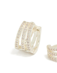 Highlighting trio layered huggie earrings with cubic zirconia in silver plated finish close up view - link has visual effect only