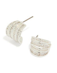 Showcasing silver plated cubic zirconia 4 layered huggie earrings front view - link has visual effect only