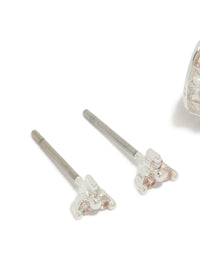 Designed with silver plated cubic zirconia trio stud and huggie earrings in a 2-pack close up view - link has visual effect only