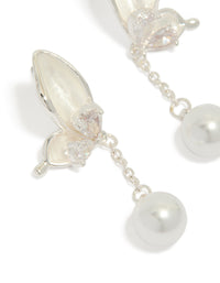 Capturing silver plated enamel butterfly pearl drop earrings featuring charm in ivory and light pink close up view - link has visual effect only