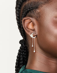 Elegant silver plated cubic zirconia moon and butterfly drop earrings with celestial charm pearl accents on ear view - link has visual effect only