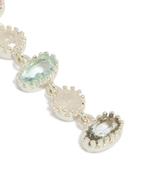 Designed with silver plated pink and blue cubic zirconia oval and round stone drop earrings in a close up view - link has visual effect only