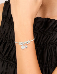 Crafted from silver plated material, this diamante heart rondell charm bracelet features beads on wrist view - link has visual effect only
