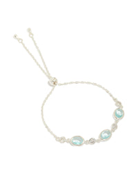 Showcasing a silver plated blue cubic zirconia large bezel trio toggle bracelet with statement design front view - link has visual effect only