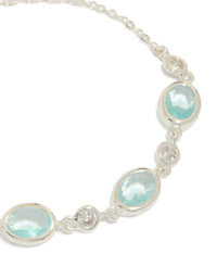 Presenting a silver plated blue cubic zirconia large bezel trio toggle bracelet with statement design close up view - link has visual effect only