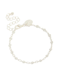 Showcasing a silver plated cubic zirconia round dainty chain bracelet front view - link has visual effect only