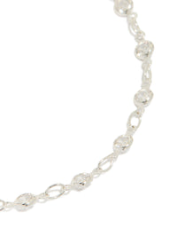 Designed with silver plated finish is this cubic zirconia round dainty chain bracelet close up view - link has visual effect only