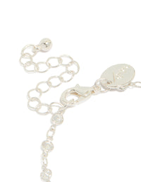 Highlighting a silver plated cubic zirconia round dainty chain bracelet closure detail view - link has visual effect only
