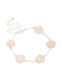 Showcasing a silver plated pink flower charms station bracelet with floral pattern in dainty style front view - link has visual effect only