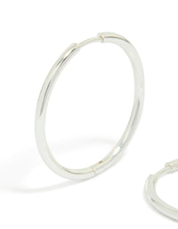Elegant waterproof silver plated stainless steel clicker hoop earrings in 30 MM close up view - link has visual effect only