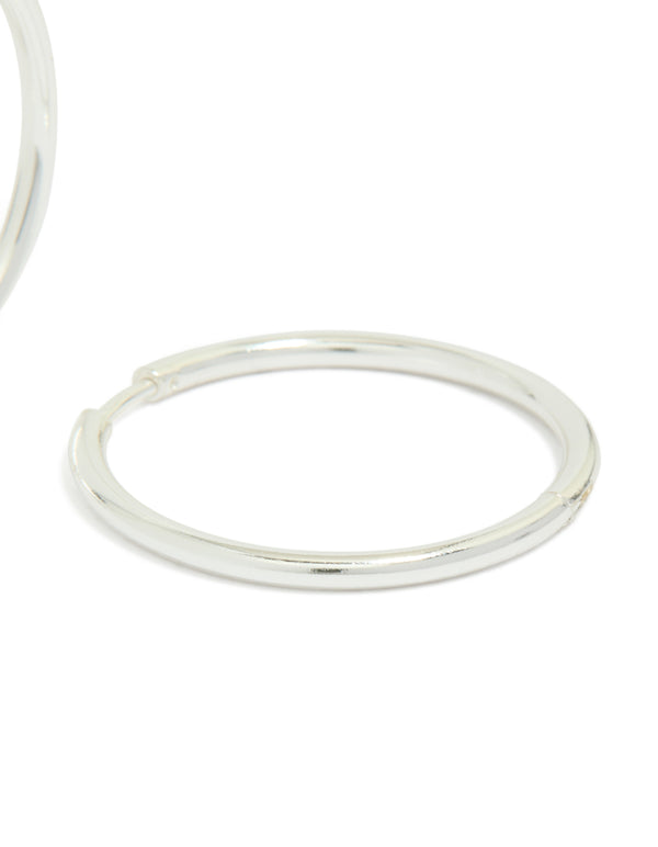 Crafted from waterproof silver plated stainless steel, these clicker hoop earrings in 30 MM post detail view