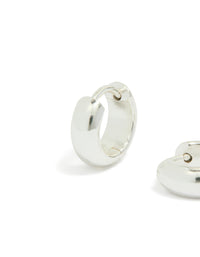 Featuring chunky waterproof huggie earrings in silver plated stainless steel close up view - link has visual effect only