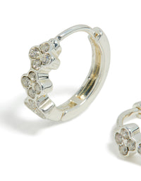 Showcasing dainty waterproof stainless steel cubic zirconia triple flower huggie earrings with crystal accents in silver close up view - link has visual effect only