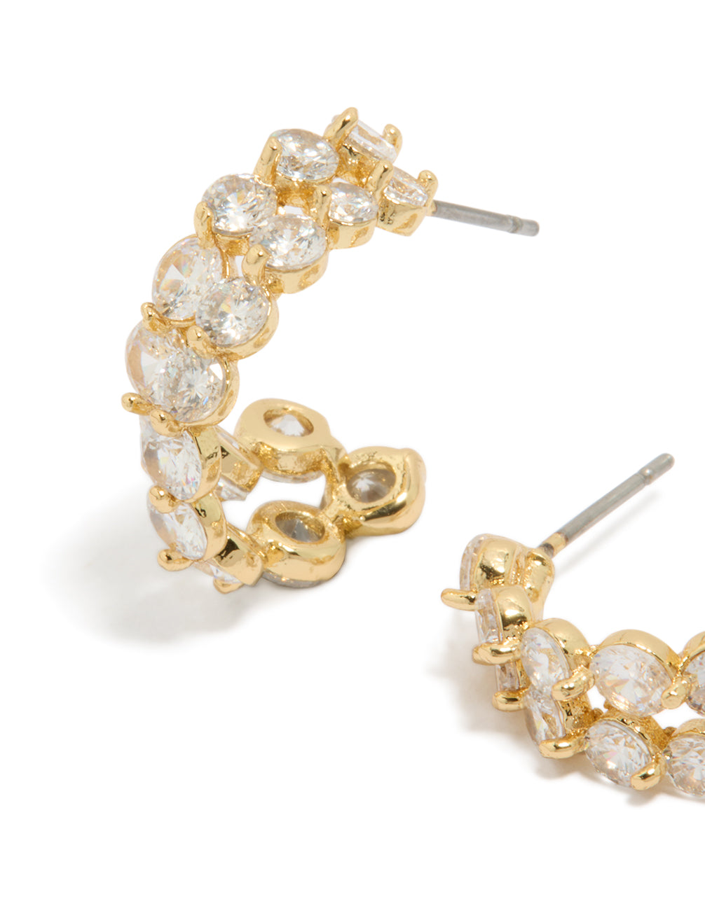 Featuring small hoop style earrings with cubic zirconia and gold plated material showcasing double layered stone setting close up view