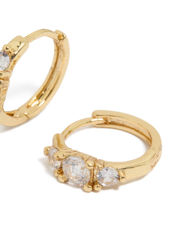 Elegant gold plated mixed sized cubic zirconia mini huggie earrings crafted with huggie closure post detail view