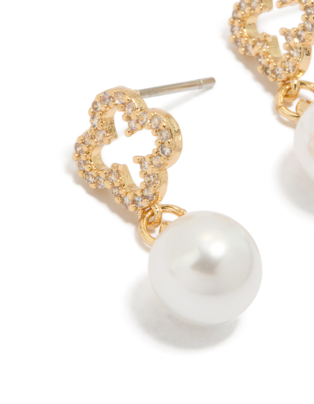 Featuring gold plated cubic zirconia outlined flower pearl earrings with intricate floral detailing close up view