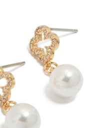 Explore the floral pearl cubic zirconia outlined flower gold plated earrings in white and gold post detail view - link has visual effect only