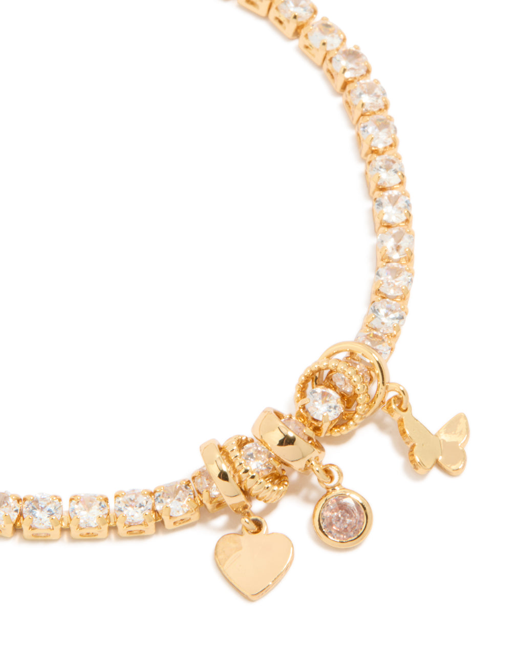 Crafted from gold plated material, this cubic zirconia tennis bracelet features mixed charms including butterfly and heart close up view