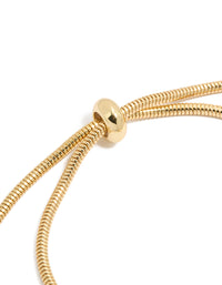 Crafted from gold plated cubic zirconia chunky heart charm toggle bracelet with statement design closure detail view - link has visual effect only