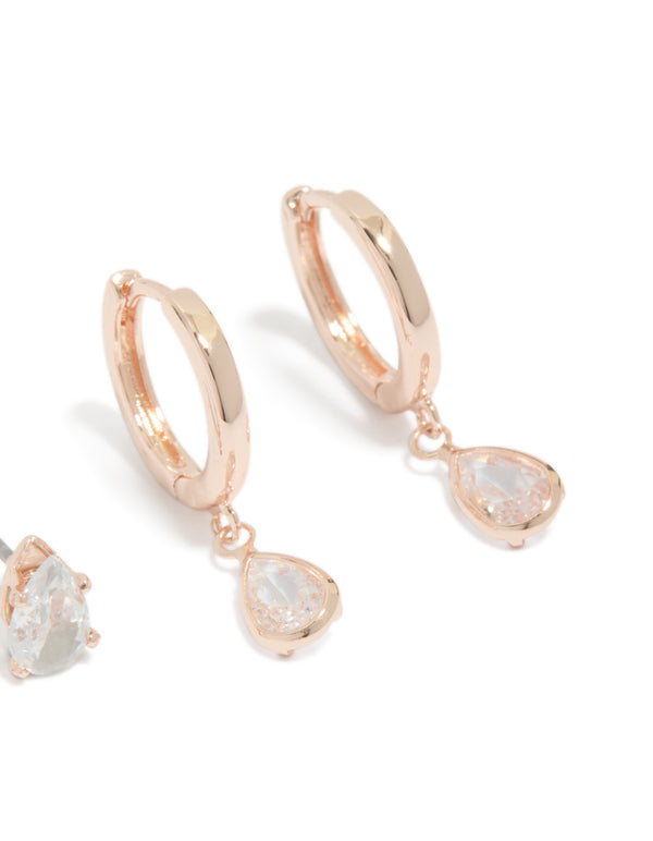 Crafted from gold-plated material, these 2-pack huggie earrings feature teardrop charm with cubic zirconia post detail view