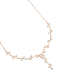 Showcasing a vine spaced necklace with floral and leaf details, crafted from cubic zirconia in rose gold plated finishes, featuring statement styling close up view - link has visual effect only