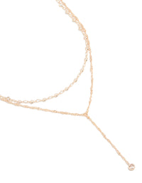 Stunning rose gold plated cubic zirconia bezel set layered chain Y-necklace with statement styling close up view - link has visual effect only