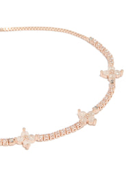 Featuring floral design with cubic zirconia in rose gold plated toggle bracelet close up view - link has visual effect only