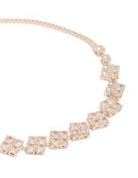 Highlighting floral rose gold plated cubic zirconia toggle bracelet close up view - link has visual effect only