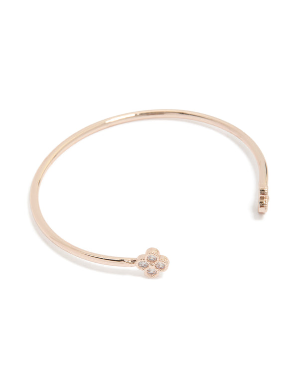 Showcasing a rose gold plated cubic zirconia flowers wrist cuff featuring floral design with gold accents front view