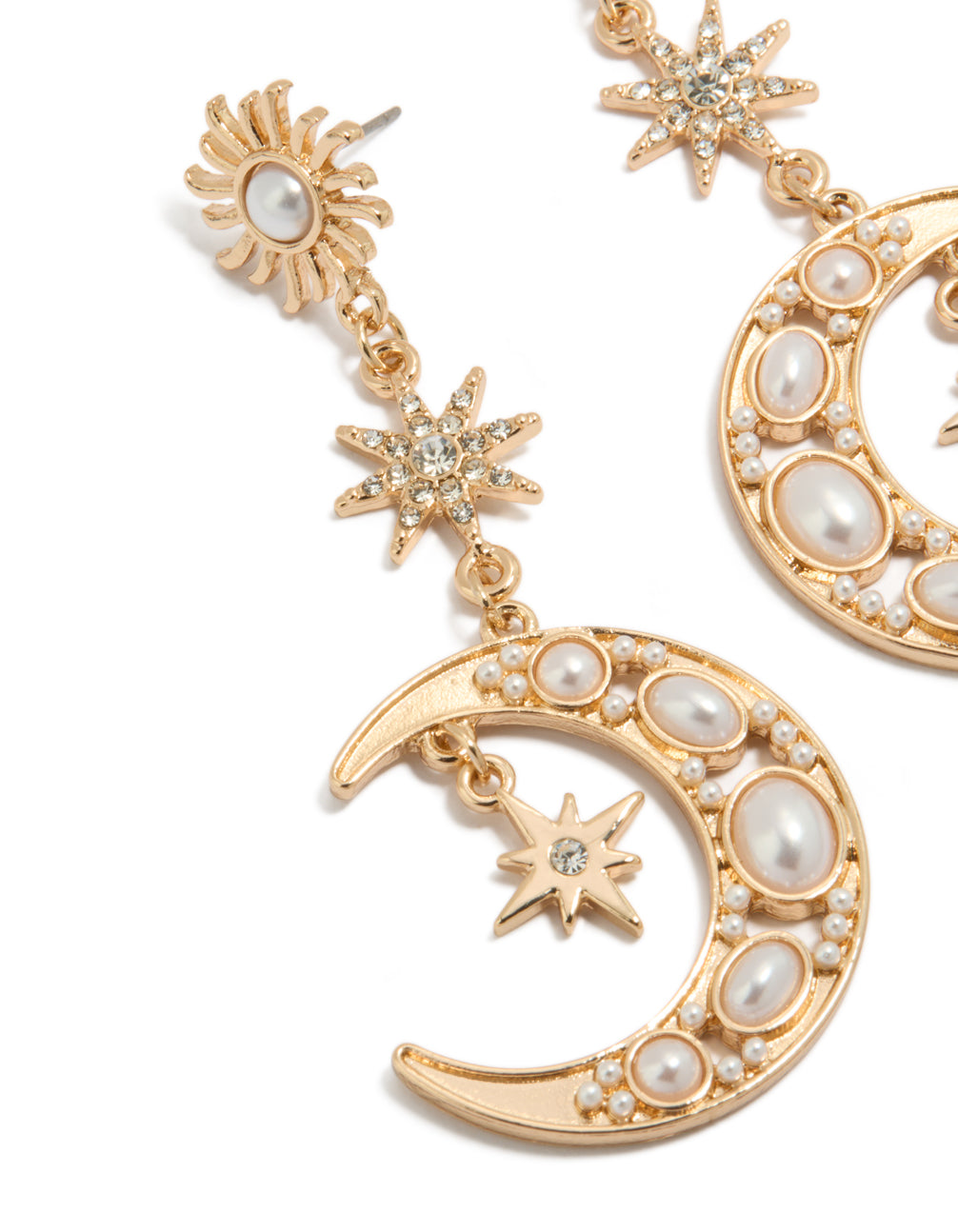 Detailed look at gold pearl celestial drop earrings with charm embellishments close up view