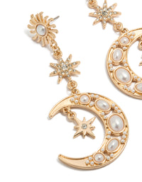 Crafted with gold and pearl is this celestial drop earrings close up view - link has visual effect only