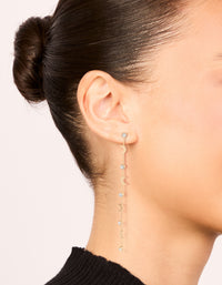 Crafted from gold featuring clear diamante and celestial charm thin drop earrings on ear view - link has visual effect only
