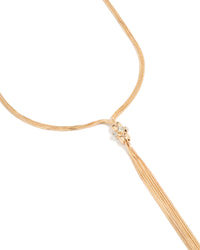 Showcasing a gold long snake tassel necklace close up view - link has visual effect only