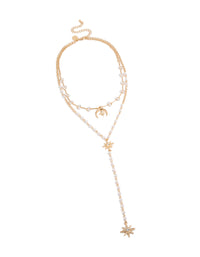 Beautifully designed layered Y-necklace with celestial charms including moon and stars adorned with pearls in gold plated finish creating a statement piece front view - link has visual effect only