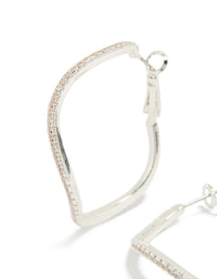 Crafted from silver diamante wavy thin hoop earrings close up view - link has visual effect only
