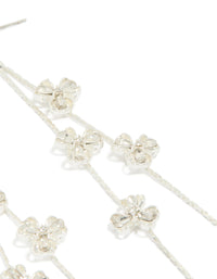 Presenting dainty silver floral drop earrings with delicate flower and clear accents detail view - link has visual effect only