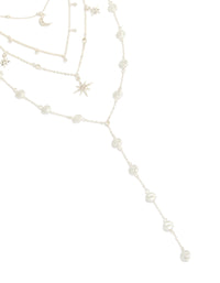Showcasing a diamante celestial multi pearl layered Y-necklace with charm, star, and moon details in statement style close up view - link has visual effect only