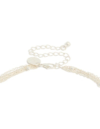 Featuring a diamante celestial multi pearl layered Y-necklace with charm, star, moon details and adjustable closure in statement style clasp detail view - link has visual effect only