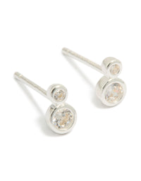 Elegant sterling silver cubic zirconia double bezel set stud earrings with clear accents front view - link has visual effect only