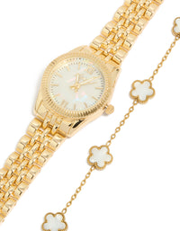 Featuring a women's analog watch and bracelet set with floral design, white dial showcasing roman numerals, round dial shape, formal occasion styling, link band strap in gold watch face detail view - link has visual effect only
